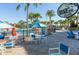 Outdoor dining area at Blue Marlin Grille with colorful umbrellas and palm trees at 880 Paradise Dr, Davenport, FL 33897