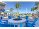 Outdoor seating area with a modern fire pit, perfect for relaxing and socializing at 880 Paradise Dr, Davenport, FL 33897