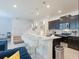 Modern kitchen with stainless steel appliances, granite countertops, and barstool seating at 880 Paradise Dr, Davenport, FL 33897