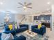 Bright living room with modern decor, adjacent to an eat-in kitchen area at 880 Paradise Dr, Davenport, FL 33897
