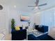 Open living room with comfortable seating, a ceiling fan, and a decorative coffee table at 880 Paradise Dr, Davenport, FL 33897