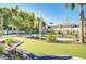 Professionally landscaped mini golf course with lush greenery and mature trees at 880 Paradise Dr, Davenport, FL 33897