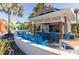 Poolside bar Rumbrelas with outdoor seating and resort pool in the background at 880 Paradise Dr, Davenport, FL 33897