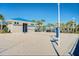 Sand volleyball court with well-maintained net and surrounding landscaping at 880 Paradise Dr, Davenport, FL 33897