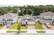 Aerial view of a charming single-story home with an attached garage and brick paver driveway at 928 Avenal Ln, Davenport, FL 33837