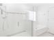 Modern bathroom featuring a large glass enclosed shower and separate tub at 928 Avenal Ln, Davenport, FL 33837