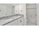 Bathroom featuring double granite vanity, updated fixtures and shower/tub at 928 Avenal Ln, Davenport, FL 33837