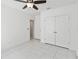 Clean bedroom with double door closet and access to the ensuite bathroom at 928 Avenal Ln, Davenport, FL 33837
