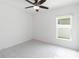 Bright bedroom featuring tile flooring, ceiling fan, and natural light at 928 Avenal Ln, Davenport, FL 33837