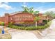 Welcoming brick entrance sign for Davenport Estates with beautiful landscaping and lush greenery at 928 Avenal Ln, Davenport, FL 33837