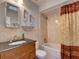 Cozy bathroom featuring bathtub and shower with decorative mirror and sconces at 929 Monroe Harbor Pl, Sanford, FL 32773