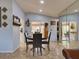 Inviting dining area with tile flooring and modern mirror accents at 929 Monroe Harbor Pl, Sanford, FL 32773