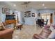 Open-concept living space with tile floors connecting to a dining area and cozy furnishings at 929 Monroe Harbor Pl, Sanford, FL 32773