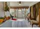 Cozy sunroom with tile flooring, ceiling fan, and views of the backyard at 929 Monroe Harbor Pl, Sanford, FL 32773