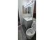 Updated bathroom with gray vanity, wood-look floors, and a tub shower at 980 Canal View Blvd # N2, Port Orange, FL 32129