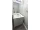 Bathroom featuring a modern gray vanity cabinet, white countertop, and framed mirror at 980 Canal View Blvd # N2, Port Orange, FL 32129