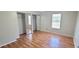 Bedroom with wood floor, double mirrored closet, and a window at 980 Canal View Blvd # N2, Port Orange, FL 32129