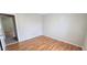 Bright bedroom featuring wood floors, a neutral wall color, and closet at 980 Canal View Blvd # N2, Port Orange, FL 32129