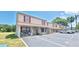 Exterior view of the residential building with parking spaces at 980 Canal View Blvd # N2, Port Orange, FL 32129