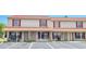 Charming condo featuring red shutters and a well-maintained exterior with convenient guest parking spaces at 980 Canal View Blvd # N2, Port Orange, FL 32129