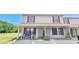 Inviting condo with cozy front porch, red shutters, and space to add your personal touch at 980 Canal View Blvd # N2, Port Orange, FL 32129