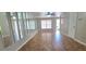 Bright and airy living room features tile flooring, lots of natural light, and accent wall mirrors at 980 Canal View Blvd # N2, Port Orange, FL 32129