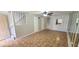 Inviting living room with tile flooring, ceiling fan, and staircase access to upper level at 980 Canal View Blvd # N2, Port Orange, FL 32129