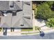 Aerial view of residential area showcasing the roofing and landscaping, plus paved parking areas at 13241 Fountainbleau Dr, Clermont, FL 34711