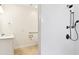 Modern bathroom with a shower and an accessible shower with a dual showerhead fixture at 13241 Fountainbleau Dr, Clermont, FL 34711