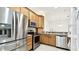 Functional kitchen with stainless steel appliances, granite countertops, and ample cabinet space at 13241 Fountainbleau Dr, Clermont, FL 34711