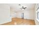 Spacious open room with light hardwood floors and neutral walls ready for your design at 13241 Fountainbleau Dr, Clermont, FL 34711