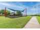 Community playground with shade structures and green space near the lake, ideal for Gathering fun at 13241 Fountainbleau Dr, Clermont, FL 34711