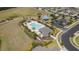 Aerial view highlighting a community pool, cabana, and lush landscaping within a well-planned neighborhood at 3302 Stonegate Dr, Ocoee, FL 34761