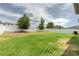 Spacious, fenced backyard with a lush green lawn and mature trees, providing a serene outdoor environment at 3302 Stonegate Dr, Ocoee, FL 34761