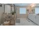 Gorgeous bathroom with a glass enclosed shower, dual sinks, and granite counters at 3302 Stonegate Dr, Ocoee, FL 34761