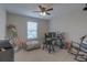 Bright bedroom with a ceiling fan, natural light, and versatile space for a home office or creative studio at 3302 Stonegate Dr, Ocoee, FL 34761