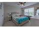 Cozy bedroom featuring a comfortable bed and natural light from the window at 3302 Stonegate Dr, Ocoee, FL 34761