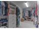 Spacious walk-in closet features custom shelving and ample storage space at 3302 Stonegate Dr, Ocoee, FL 34761