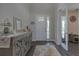 Bright foyer featuring wood flooring, decorative rug, console table, and views of the home's interior at 3302 Stonegate Dr, Ocoee, FL 34761