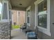 Cozy covered front porch with stone columns, comfortable seating, and space to relax outdoors at 3302 Stonegate Dr, Ocoee, FL 34761