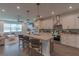 Modern kitchen featuring a central island, granite countertops, and stainless steel appliances at 3302 Stonegate Dr, Ocoee, FL 34761