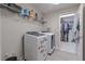 Well-lit laundry room with modern washer and dryer at 3302 Stonegate Dr, Ocoee, FL 34761