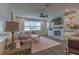 Comfortable living room with plush seating, modern fireplace, built-in shelving, and plenty of natural light at 3302 Stonegate Dr, Ocoee, FL 34761