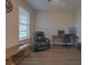 Home office area with a black recliner, desk, computer, and comfortable workspace at 3302 Stonegate Dr, Ocoee, FL 34761