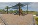 Community playground with modern shade structure and play equipment for outdoor fun at 3302 Stonegate Dr, Ocoee, FL 34761
