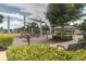 Community playground with modern equipment, shaded structures, and lush landscaping for Gathering enjoyment at 3302 Stonegate Dr, Ocoee, FL 34761