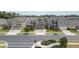 Street view featuring three two-story homes, each with a driveway leading to an attached garage at 3302 Stonegate Dr, Ocoee, FL 34761