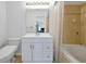 Bathroom with a soaking tub and white vanity, offering a clean and bright space at 10374 Park Commons Dr, Orlando, FL 32832