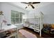 Bedroom features bunkbeds, a desk, and a window at 10374 Park Commons Dr, Orlando, FL 32832