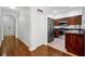 Spacious kitchen with stainless steel appliances, dark wood cabinets and granite countertops at 10374 Park Commons Dr, Orlando, FL 32832